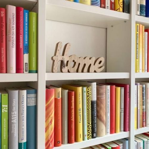 Library shelves and one part filled with a wooden heart